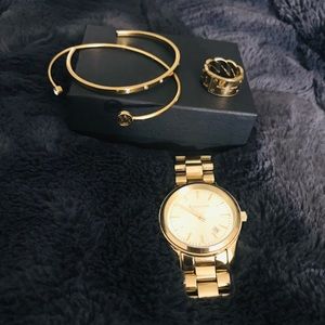 Michael Kors gold jewelry set.